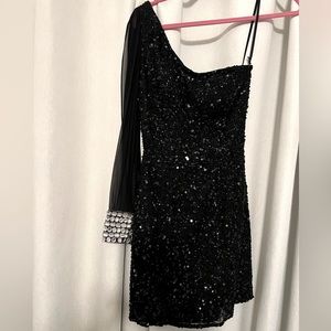 Shail K, one sleeved dress.